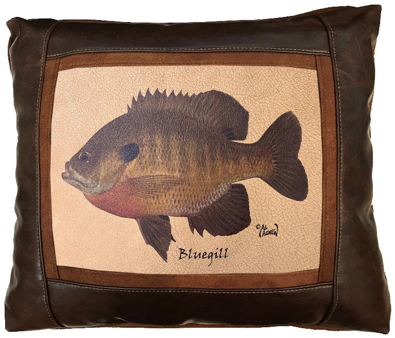 Pillow with a bluegill fish design on a beige background, framed by brown leather.
