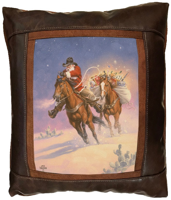 Decorative pillow with a snowy Christmas scene of Western Santa Claus riding a horse, followed by a horse carrying a large sack full of christmas toys and presents.