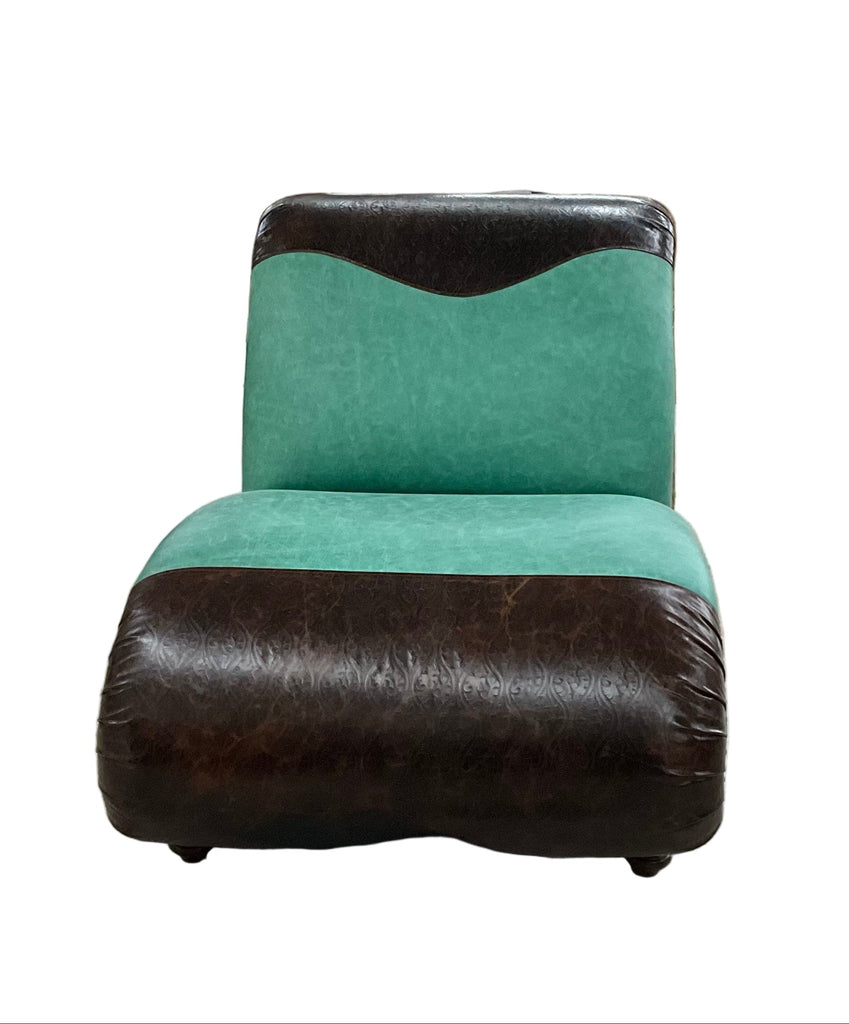 Green and brown chair in a warehouse setting with various items in the background