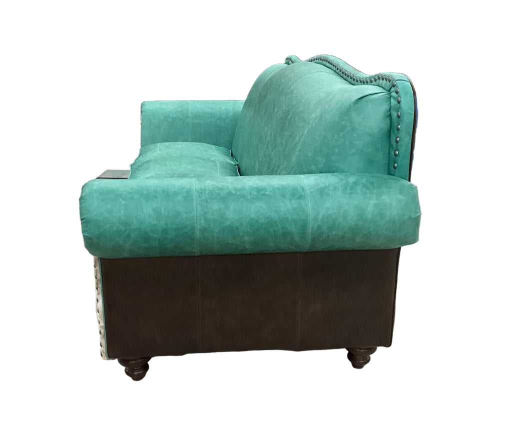 Green armchair in a warehouse setting with shelves in the background