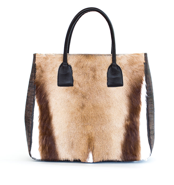 Handbag with brown and black fur pattern on a white background