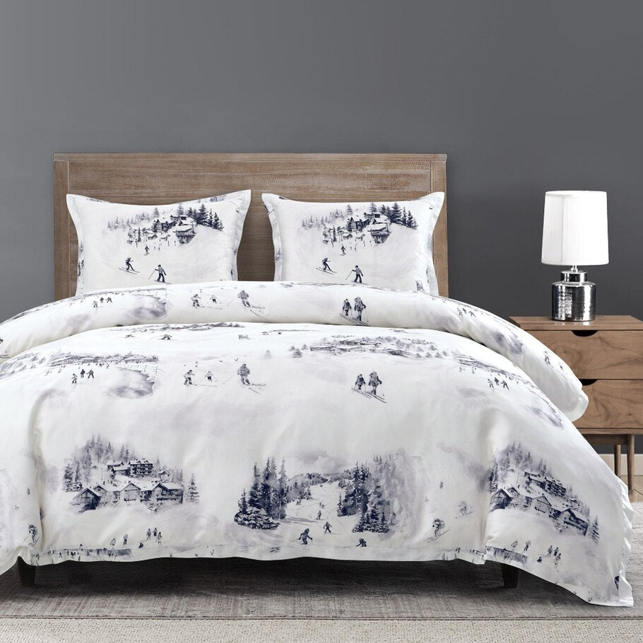 Alpine Lyocell Bedding Set featuring a watercolor design of skiers gliding through snow-covered mountains and chateaus, capturing the essence of alpine serenity.​