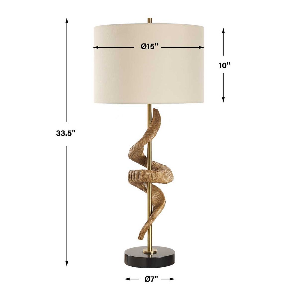antique brass column and a thick black marble base with rams horn wrapped around column. Comes with Off-white linen shade shown with overall measurements