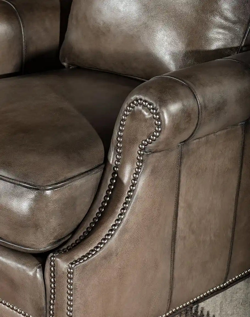Detailed shot of the armrest showcasing the meticulous craftsmanship and smooth leather finish.