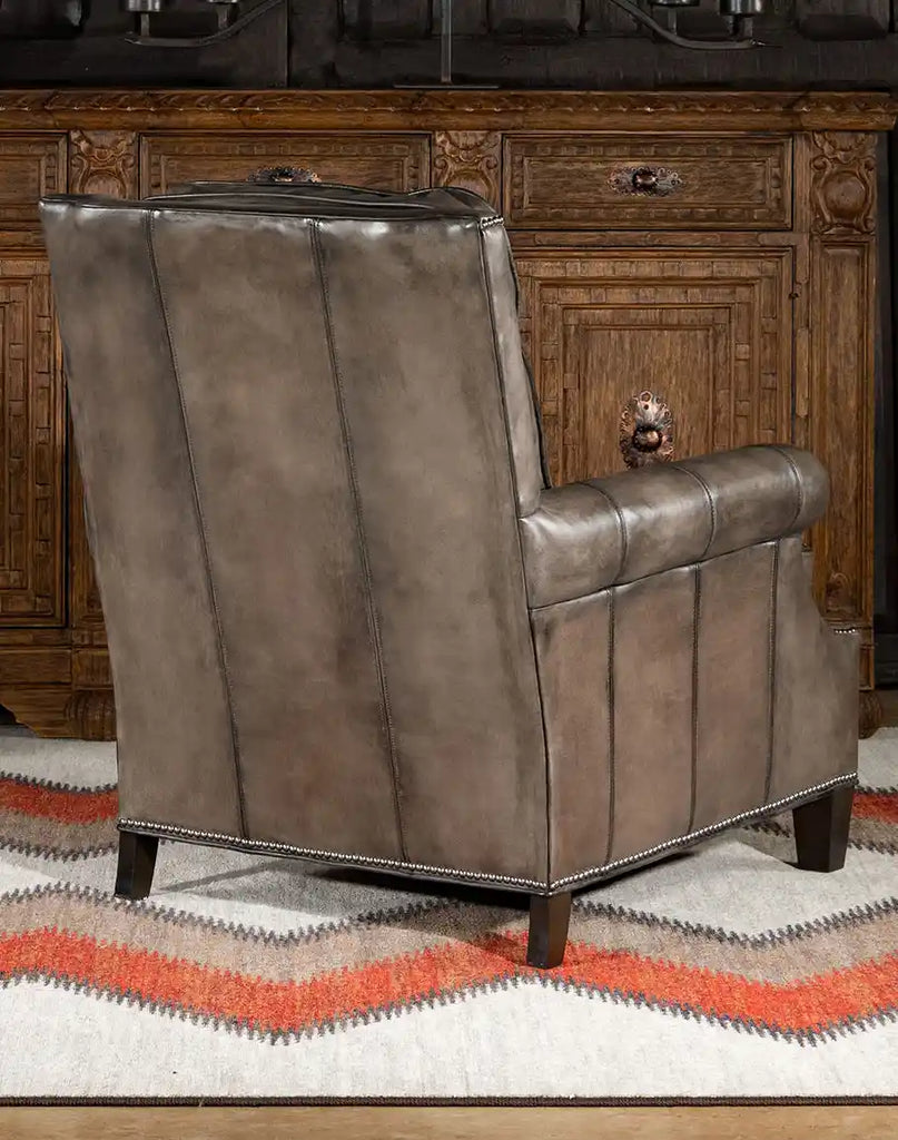 Rear view displaying the smooth, hand-antiqued leather finish and the chair's solid framework.