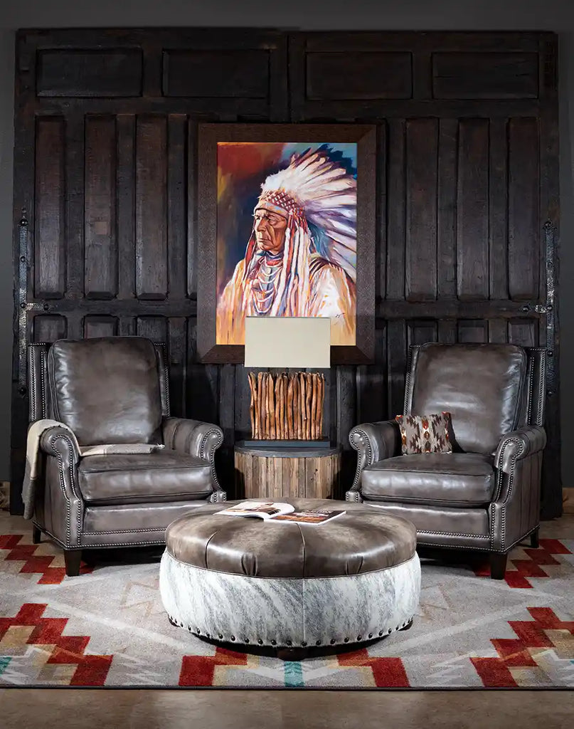 The Ashton Leather Chair placed in a rustic living room setup.