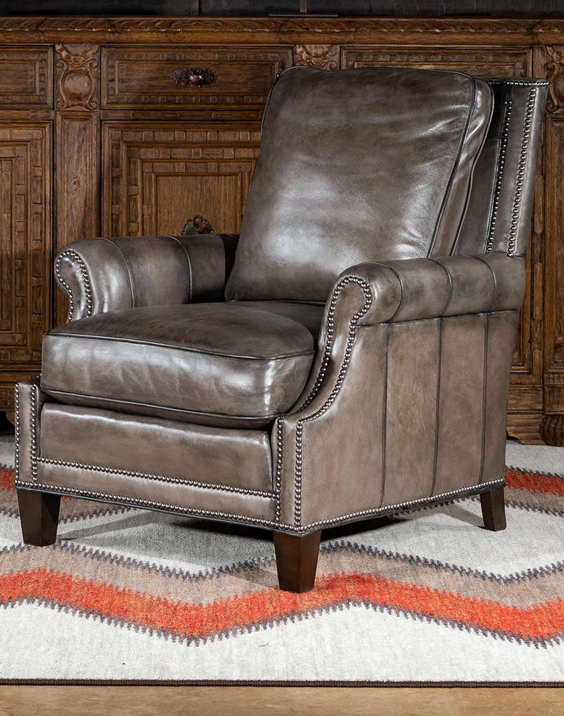Front-facing view of the Ashton Leather Chair showcasing its pewter-colored, hand-antiqued leather upholstery and plush pillow back design.