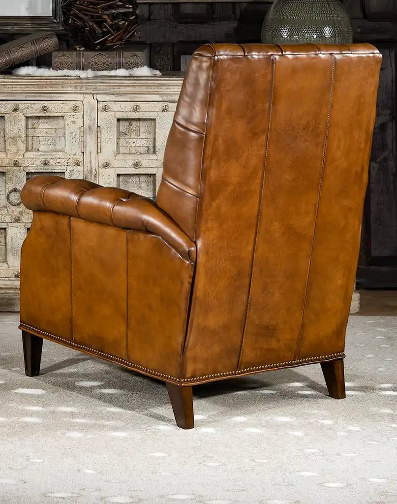 Rear view displaying the smooth, tan-colored leather finish and the chair's solid framework.