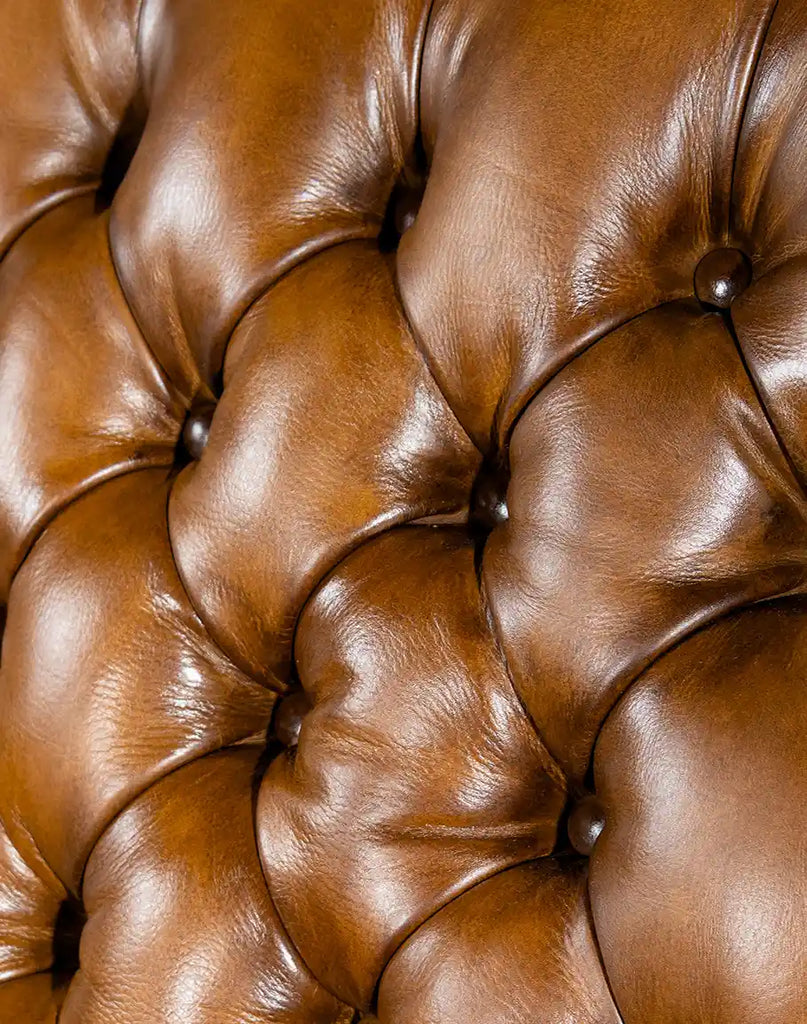 Detailed shot focusing on the deep button-tufted design of the backrest, emphasizing craftsmanship and comfort.