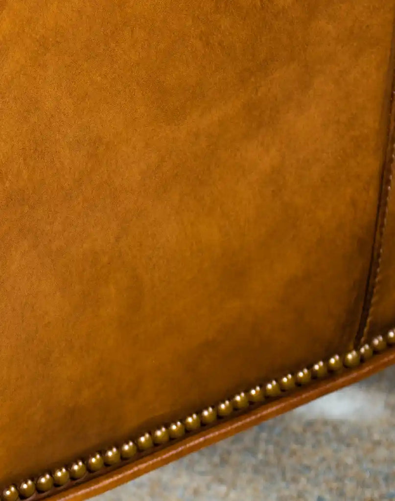 Detailed shot focusing on the premium, tan-colored leather texture, showcasing quality and durability.