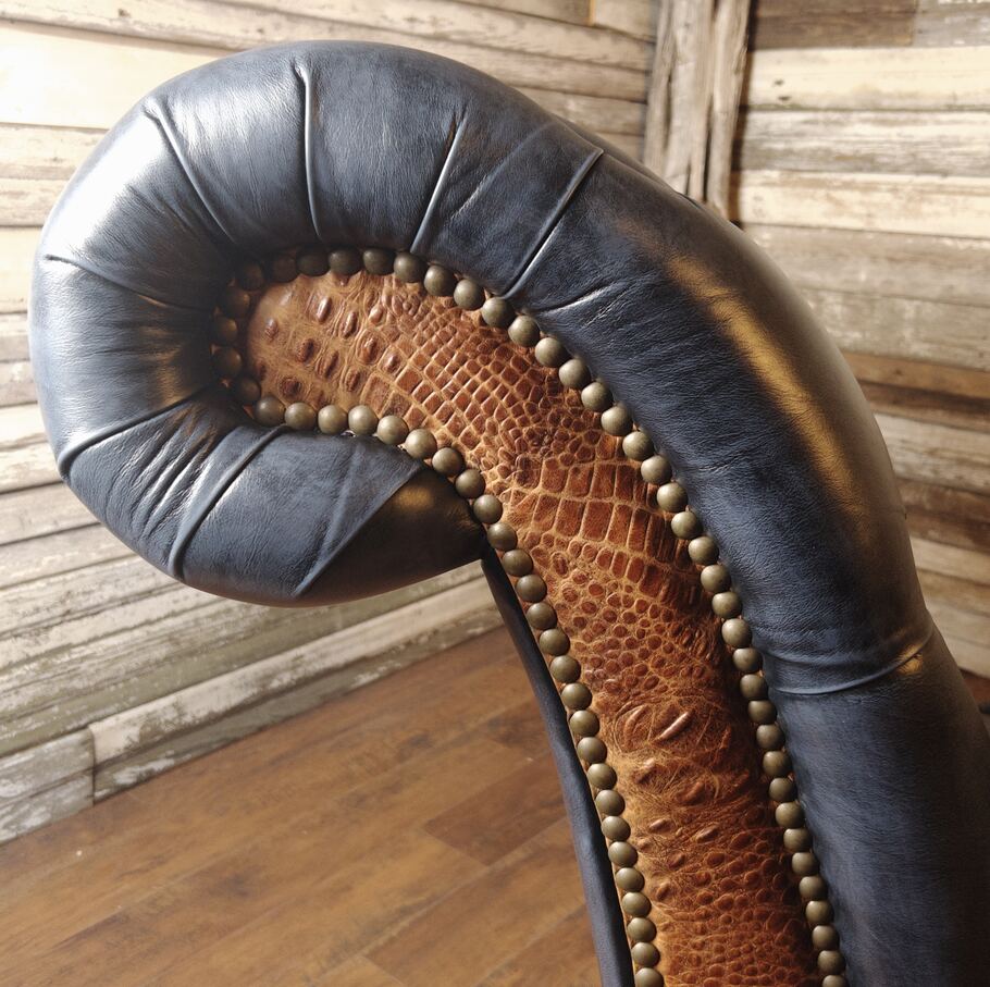 Close-up shot capturing the rich texture and quality of the Brindisi Adriatic leather used in the Baltimore Chaise Lounge.