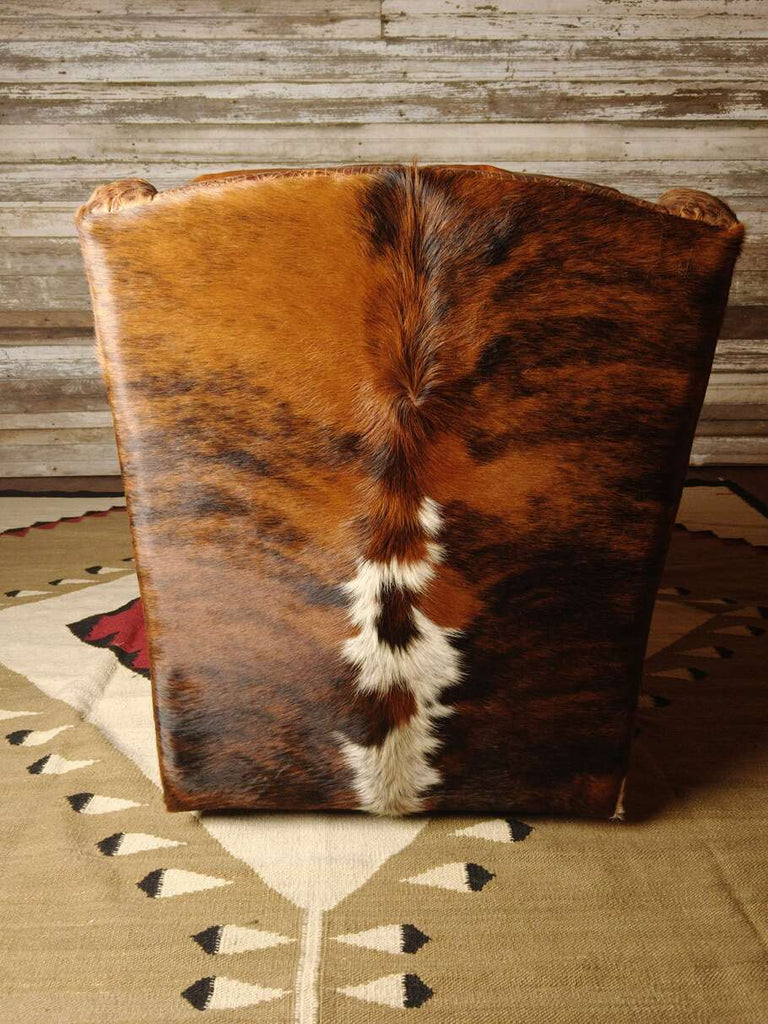 The back of the Bedford Cowhide Swivel Glider, featuring detailed embossed Gator Hornback Rustic Cognac leather for a bold Western touch.