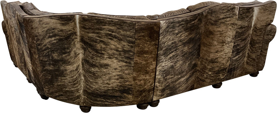 A close-up of the medium exotic brindle cowhide accents on the Big Bear Reclining Sectional Sofa, adding a rustic and elegant touch to the design.