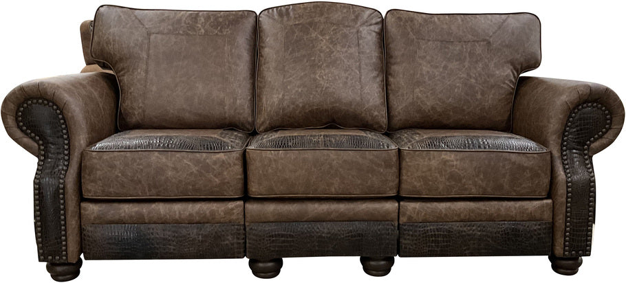 The Big Bend Double Reclining Sofa in Palio Rum leather, featuring Gator Hornback Rustic Walnut accents and a white brindled Brazilian cowhide wrap, showcased in a front-facing view.