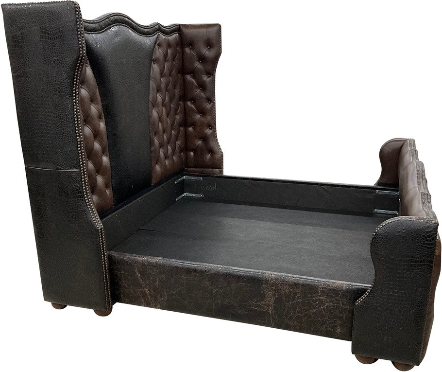 A side view of the Black Canyon Bed highlighting the plush truffle leather upholstery and intricate croc leather detailing on the footboard.