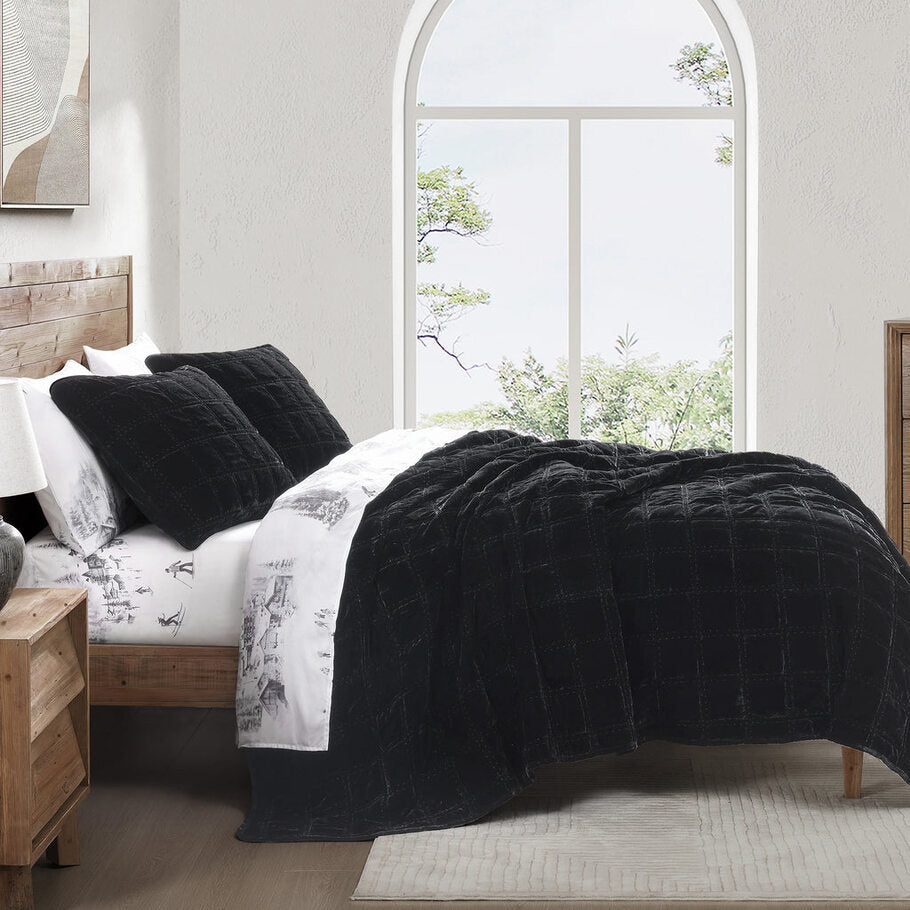 Black Faux Silk Velvet Quilt Set styled in a contemporary bedroom, complementing neutral tones and minimalist décor.