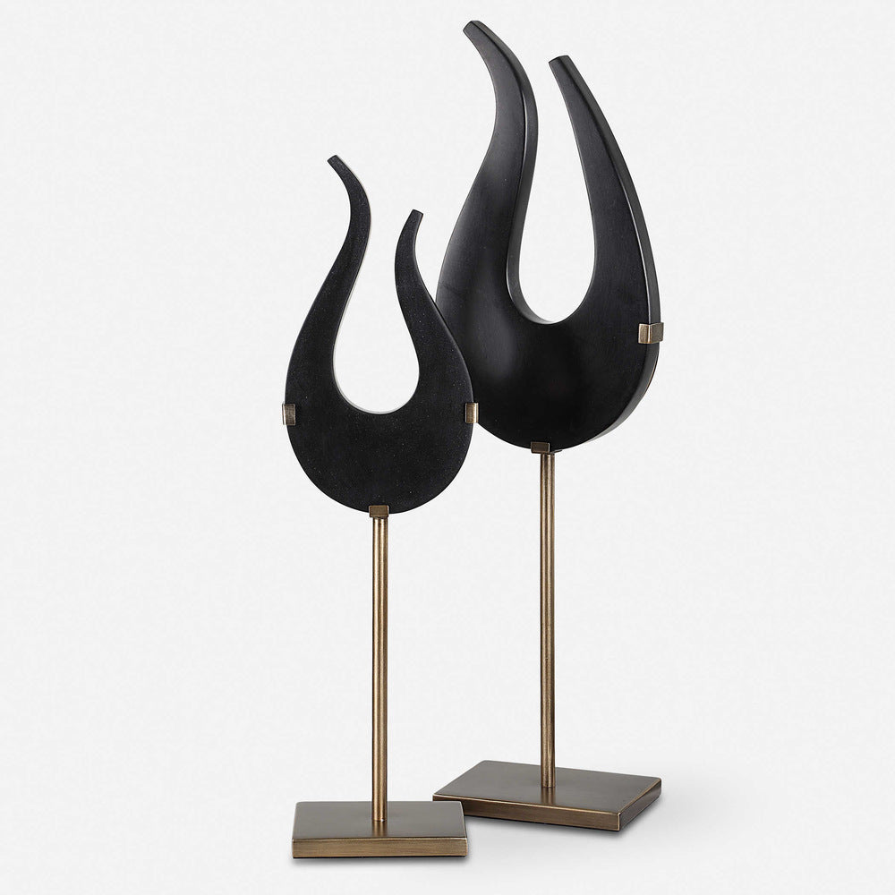 Black Flame sculptures in small and large sizes, showcasing black stone and brushed brass bases for a stylish look