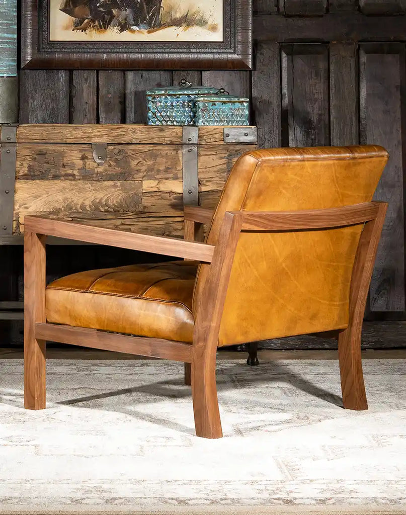 Rear image showing the refined walnut wood frame and expertly stitched leather upholstery.