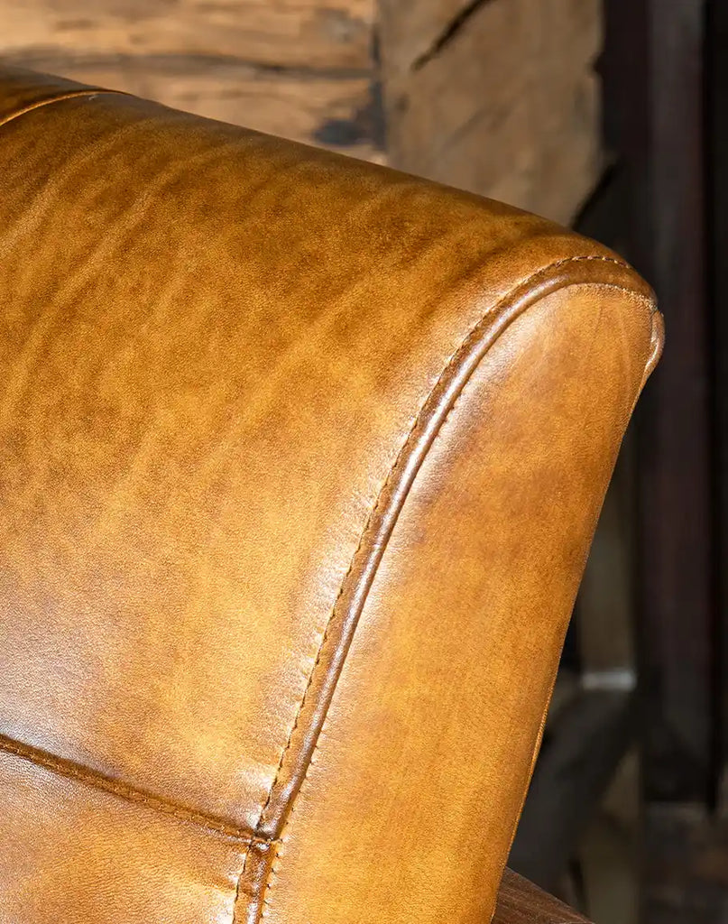 Detailed shot showcasing the rich texture of the hand-brushed full grain leather, emphasizing its unique character.