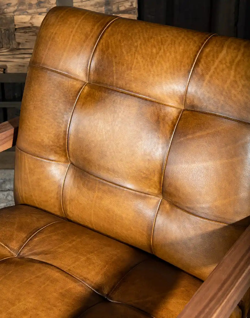 A focused image highlighting the plush seat cushion and intricate stitching that enhances both comfort and durability.