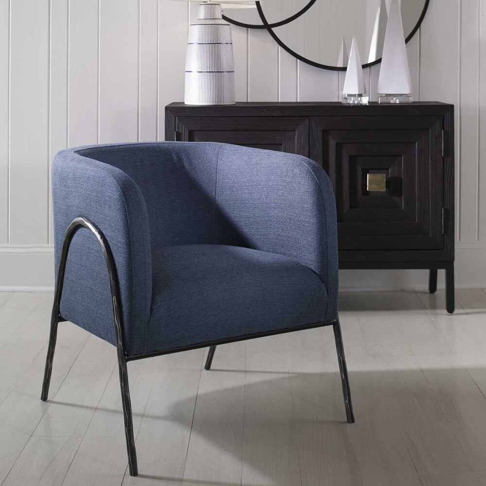 Scandinavian-inspired barrel back chair with regatta blue upholstery and aged black iron chiseled frame.