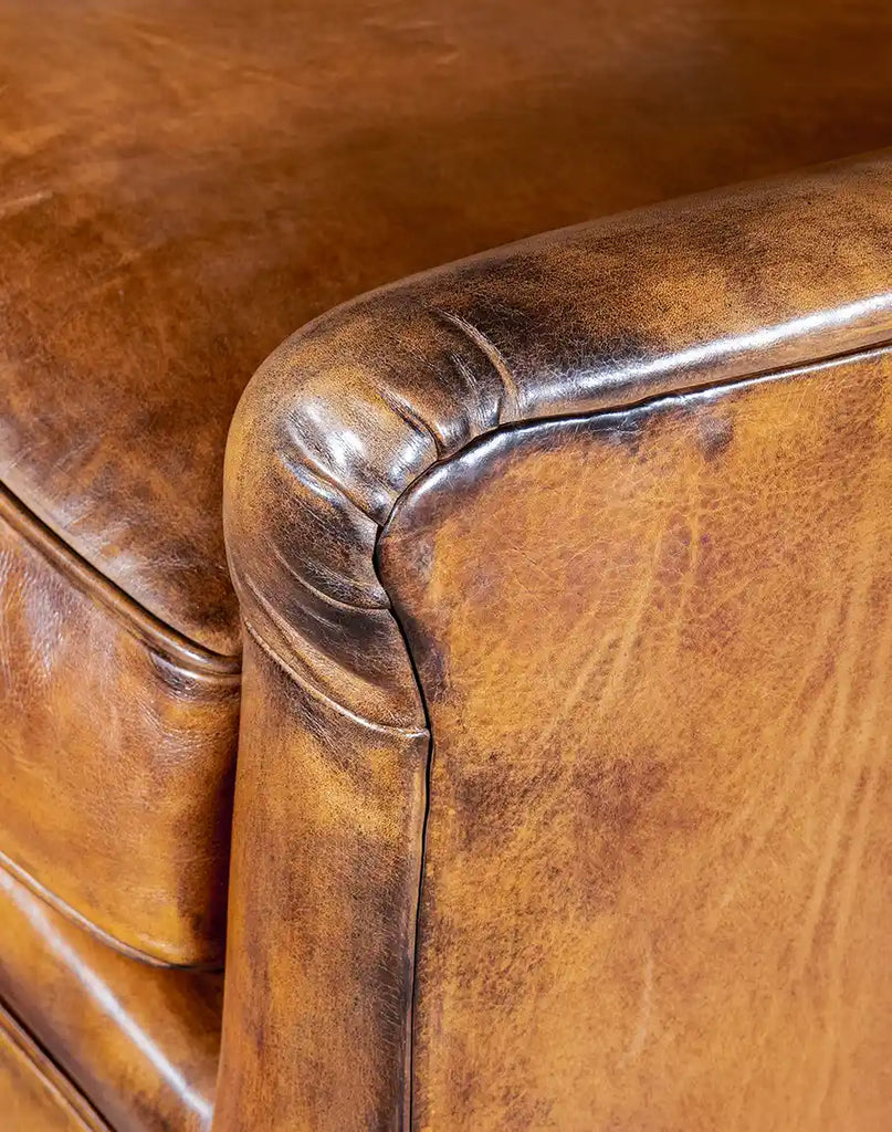 Detailed shot of the armrest showcasing meticulous craftsmanship and smooth finish.