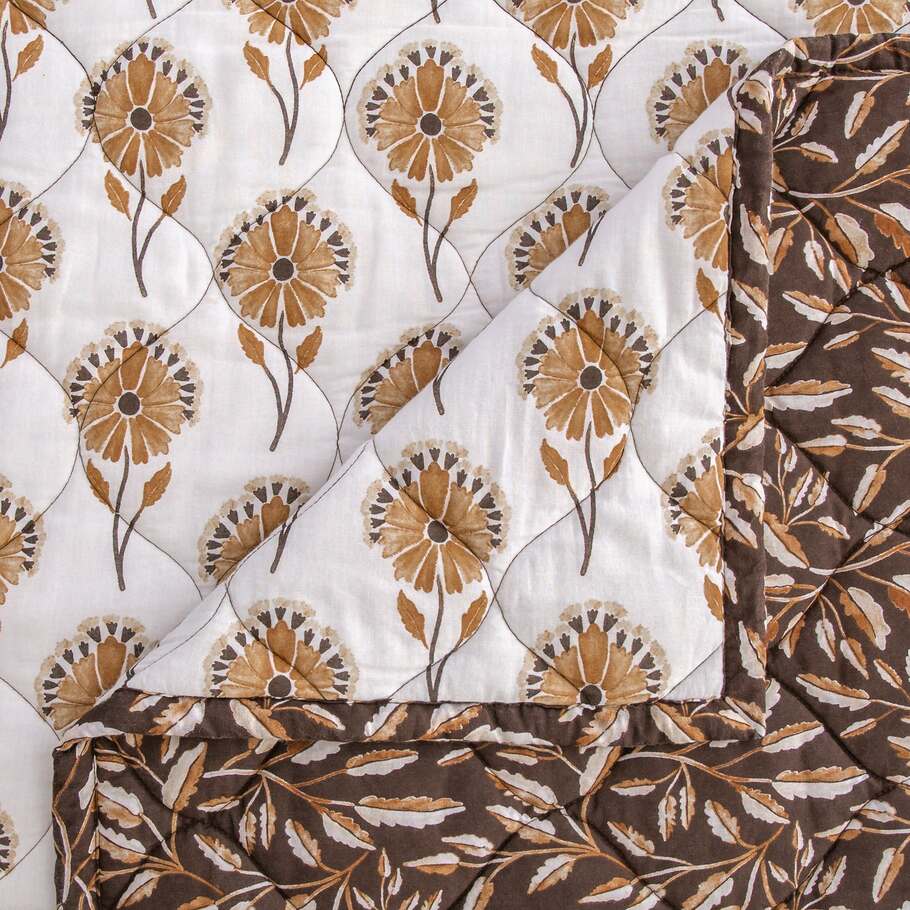 Detailed view highlighting the vibrant autumn leaf design on the Brentwood Quilt, capturing the rich colors of fall.