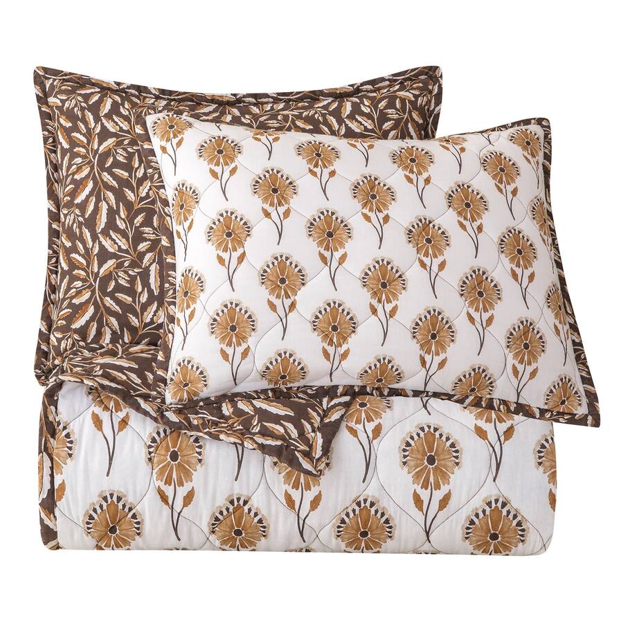 Brentwood Reversible Quilt Set featuring vibrant autumn leaf patterns on one side and delicate watercolor florals on the reverse, enhanced with unique diamond stitching.