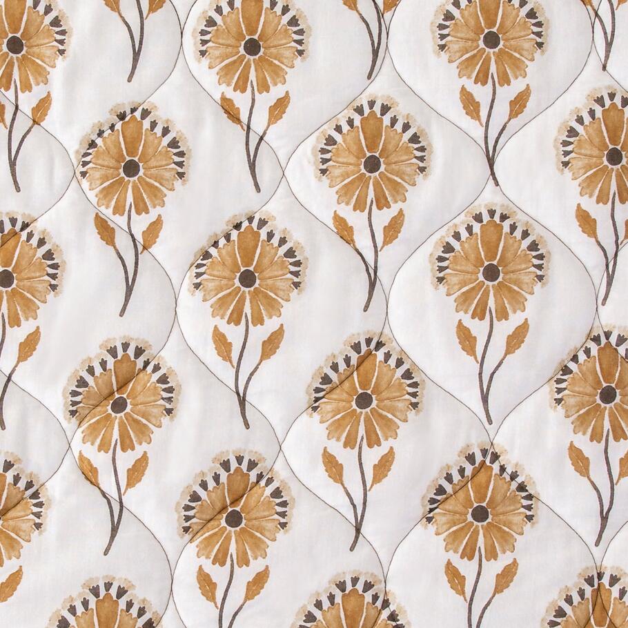 Detailed view showcasing the delicate watercolor floral pattern on the reverse side of the Brentwood Quilt, offering a softer aesthetic.