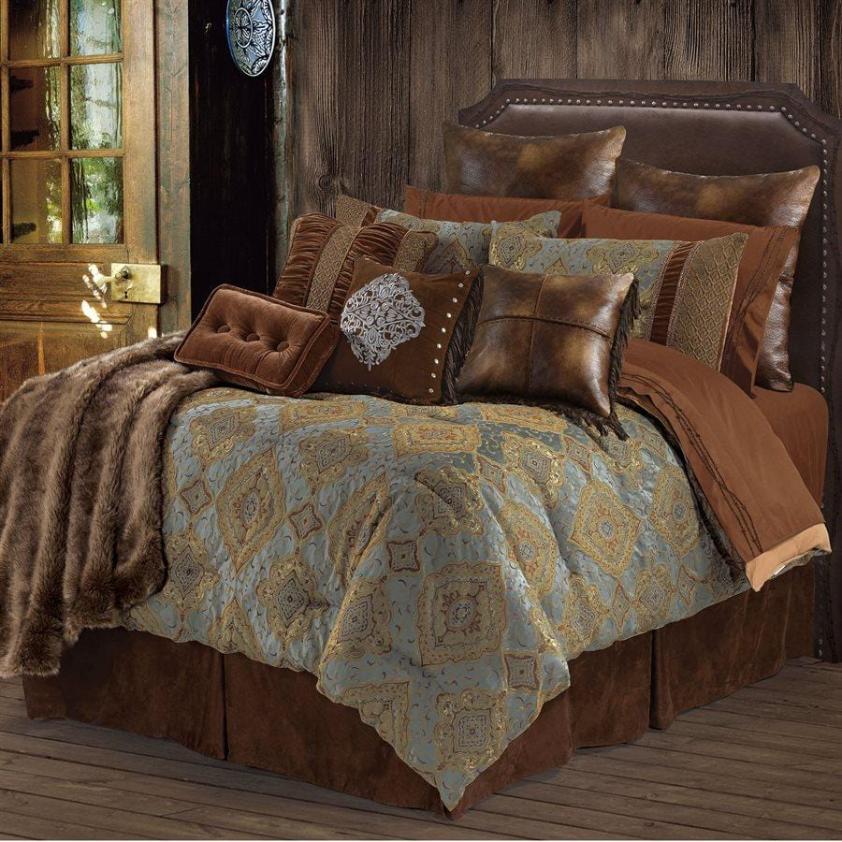 Twin size Brianna Lodge Comforter Set featuring an elegant brocade design with golden threads and warm chocolate browns on a dusty turquoise satin background, styled on a rustic wooden bed frame.​