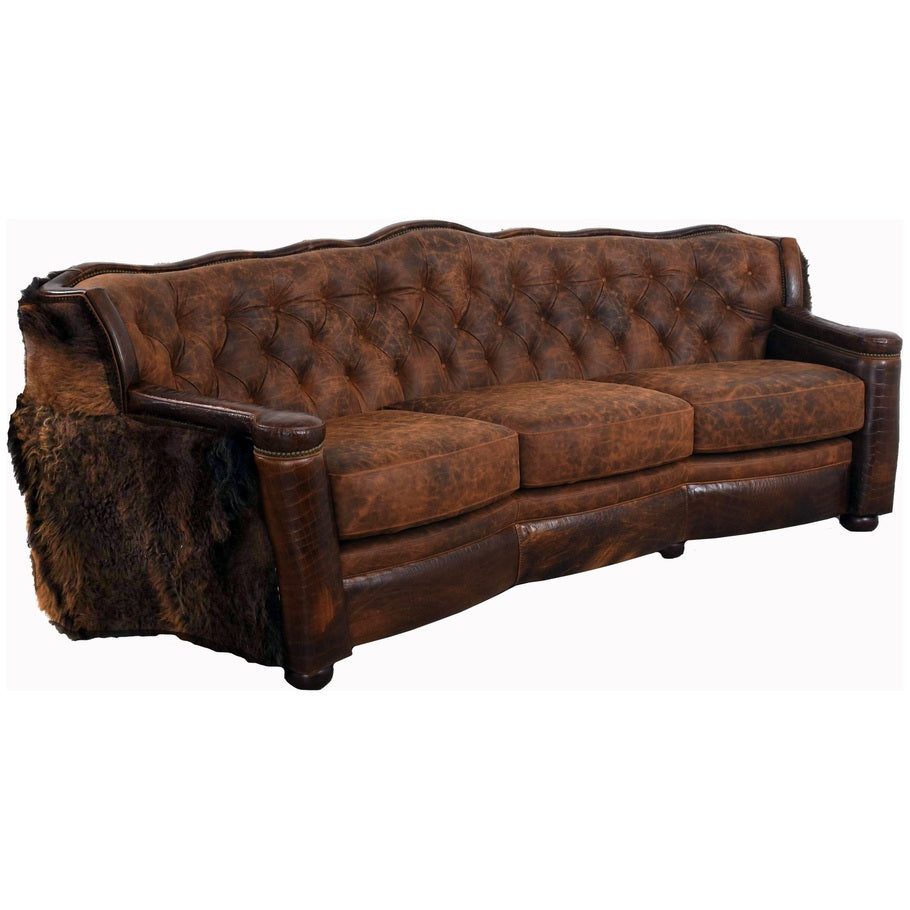 A side-angled view of the Buffalo Curved Tufted Sofa, showcasing its curved design, tufted detailing, and luxurious Buffalo hide upholstery.