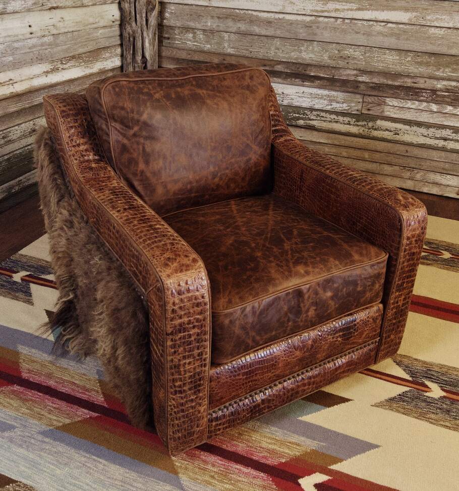 Side angle of the Buffalo Luxe Swivel Chair, highlighting its scalloped arms, luxurious leather upholstery, and expertly crafted swivel base for functional comfort.