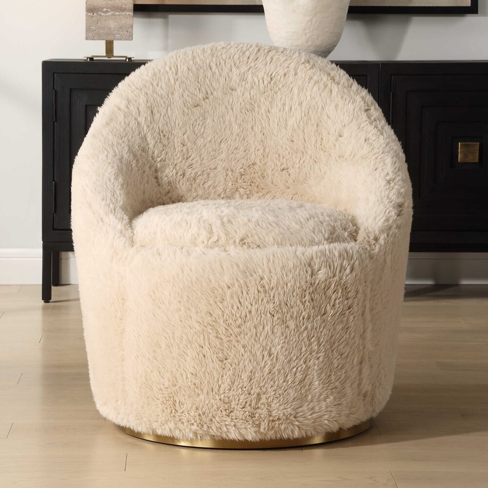 Carmela Fluffy Swivel Chair with warm caramel faux sheepskin upholstery and a plated brass stainless steel swivel base.