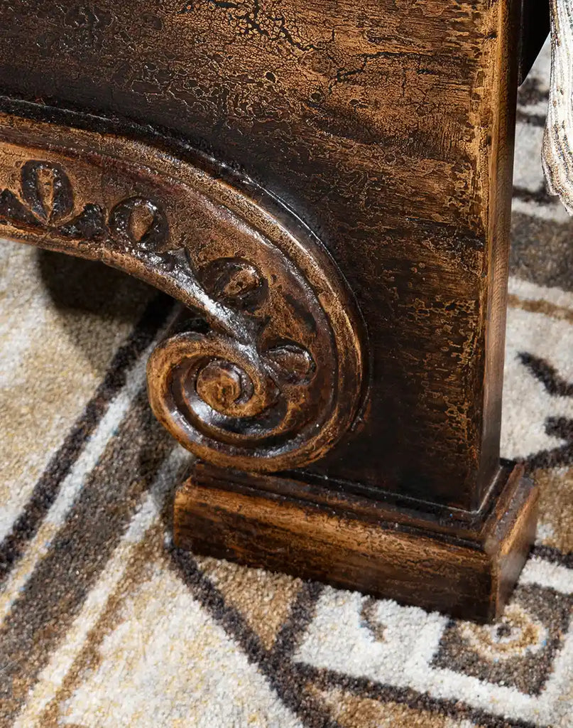 Image focusing on the intricately designed support legs of the Carolina Bed, reminiscent of Gothic architecture.