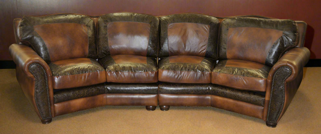 Brown leather sectional sofa with tooled picture framing accents on each seat cushion and back cushion on a red  background