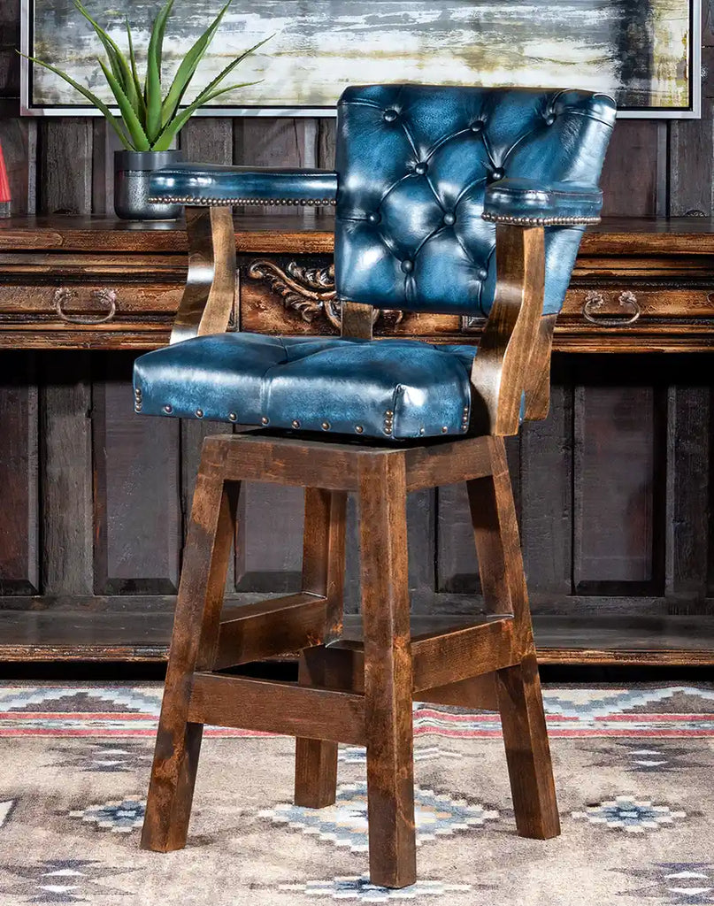 Chisum Hondo Barstool featuring solid alder wood, blue leather upholstery, and button-tufted detailing.