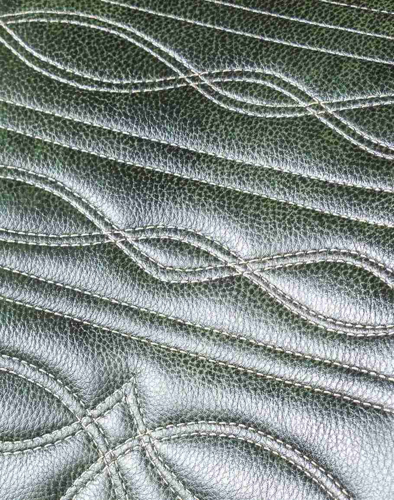 Close-up of the Chisum TX Olive Green Barstool's cowboy boot stitch detail on the seat back for added sophistication.