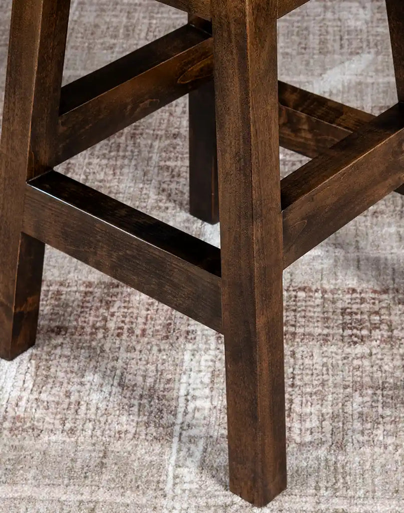Sturdy base of the Chisum TX Paraluman Barstool made from solid American alder wood for long-lasting stability.