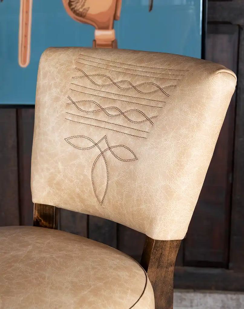 Detailed close-up of the durable semi-protected top-grain leather upholstery on the Chisum TX Paraluman Barstool.