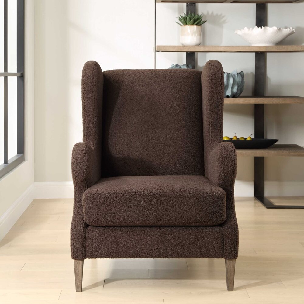 Serpentine Coffee Accent Chair with chocolate faux shearling and solid wood tapered legs in a weathered walnut finish.
