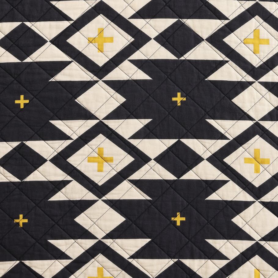Detailed view highlighting the large geometric motifs and rich color palette of the Sonoran Desert Reversible Quilt Set.