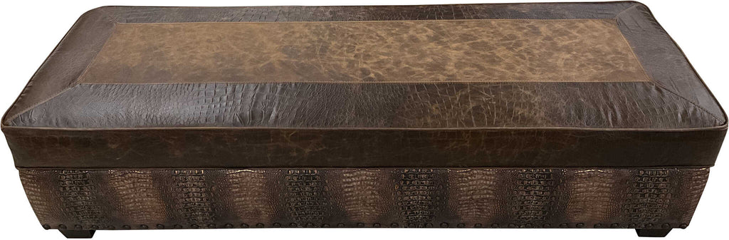 Top view of the Cora Storage Ottoman, upholstered in distressed Cora Pecan leather with Croc Brompton border accents, showcasing its Western-inspired design.