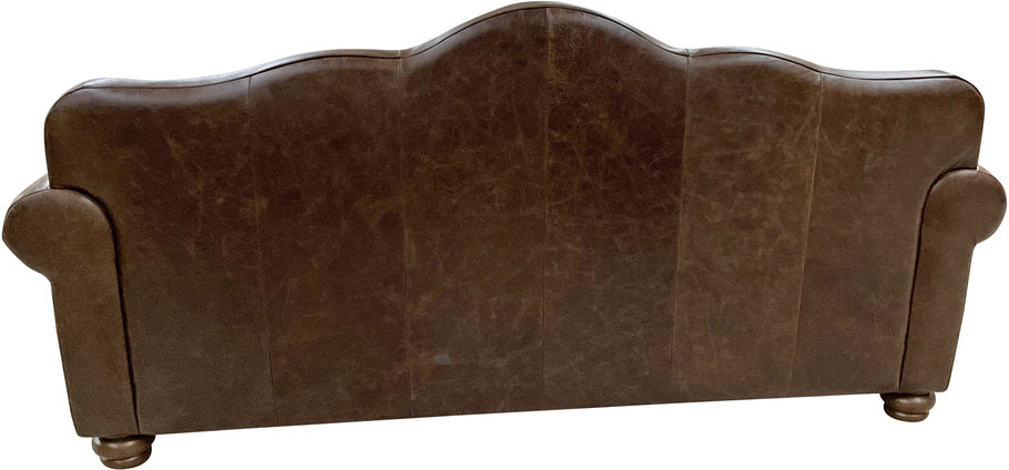 Rear view of the Crowned Camelback Sofa, showcasing its elegant camelback silhouette, rich Kodiak Bear leather upholstery, and classic Western-inspired design.