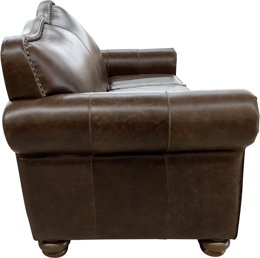 Side angle of the Crowned Camelback Sofa showcasing its elegant curves, tightback cushion, and rich Western-inspired design.