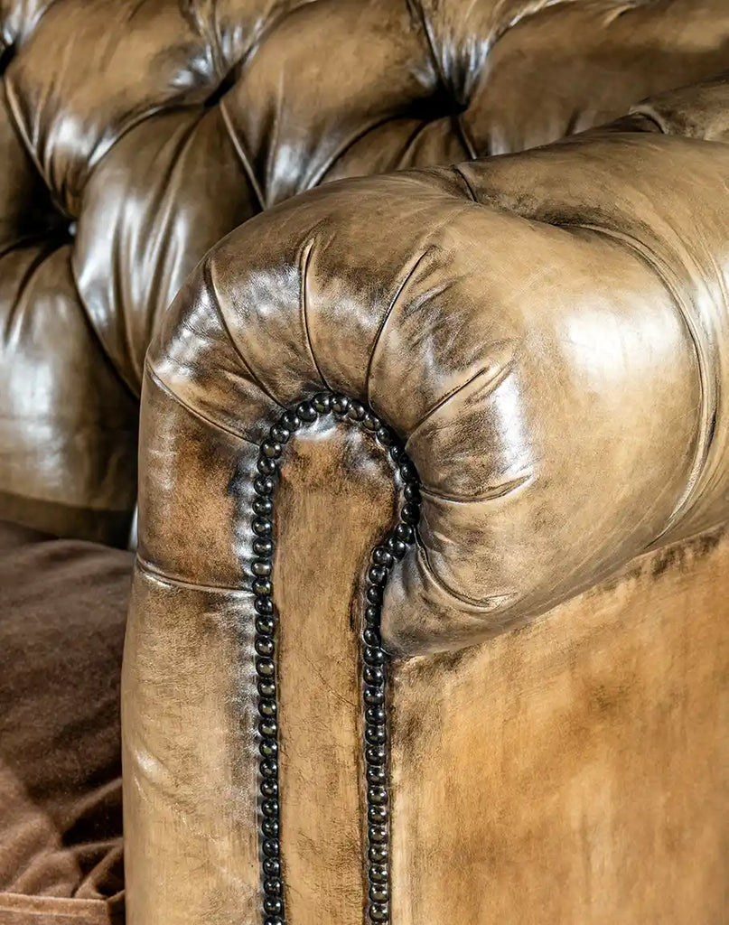 Hand-applied nailhead trim accentuating the sophisticated design of the Dallas Chesterfield Sofa.