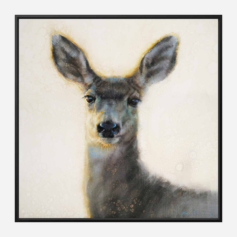 Framed artwork of a deer's head on a textured beige background