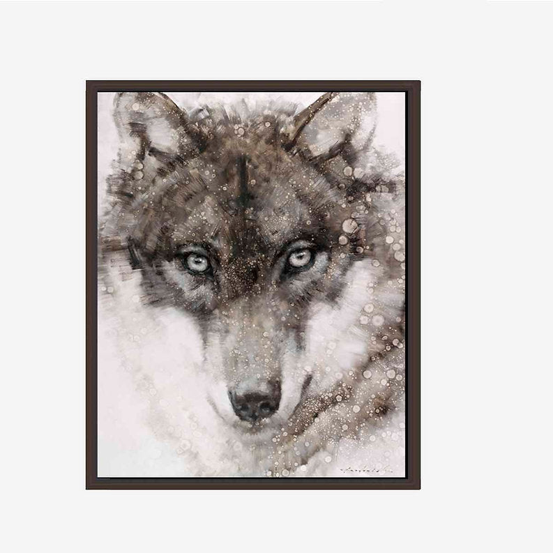 Framed artwork of a wolf's face with a snowy background