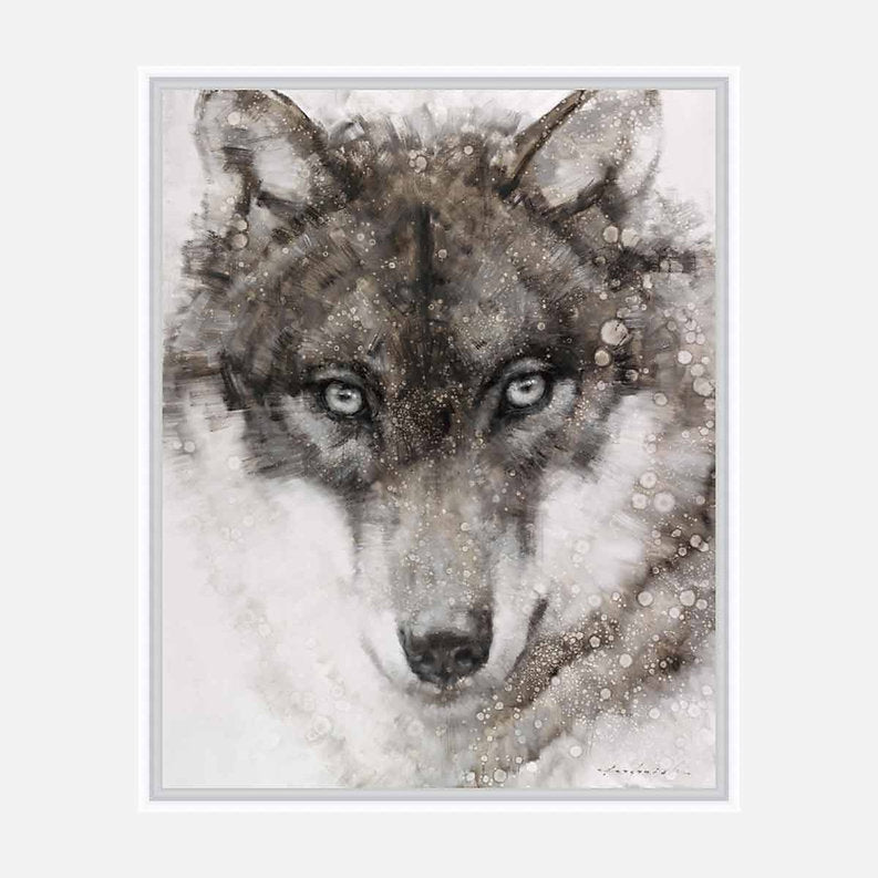 Framed artwork of a wolf's face with a snowy background