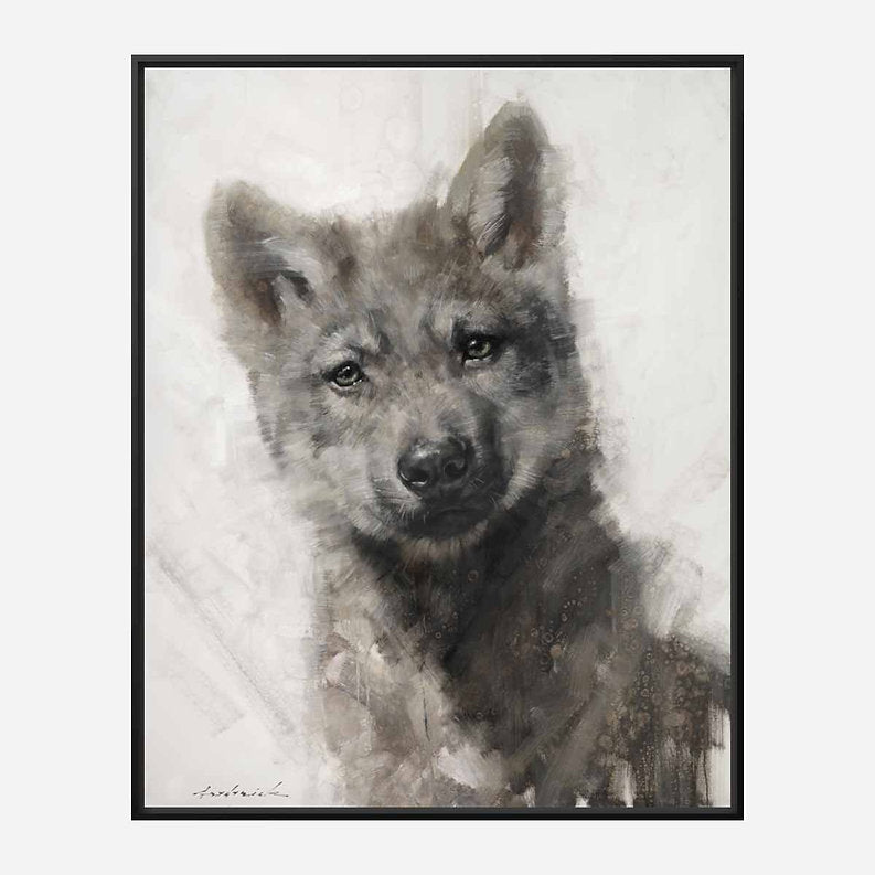 Black framed artwork of a wolf cub on a light background.