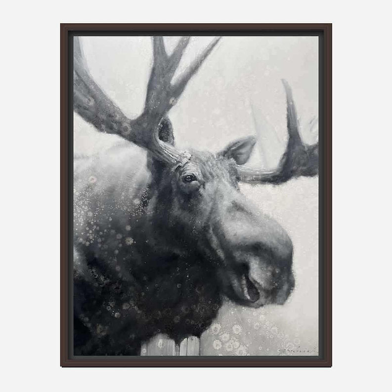 Framed artwork of a moose in a snowy landscape